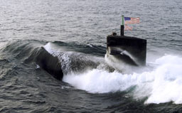 submarine with American flag above surface